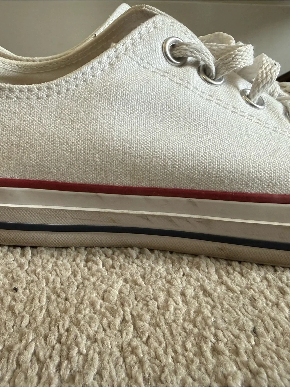 Converse Low Top Sneakers in White with Red Trim